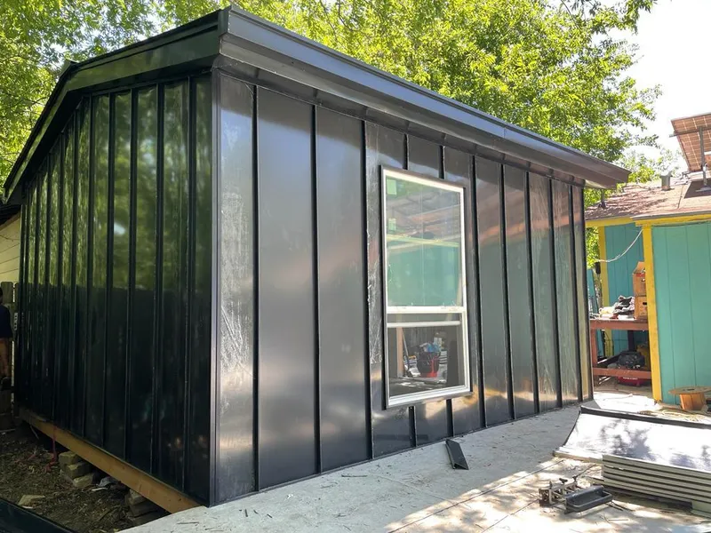 Black standing seam metal wall panels for Roof Inspection in Pine